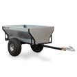 Small metal dump cart with wheels on a white background